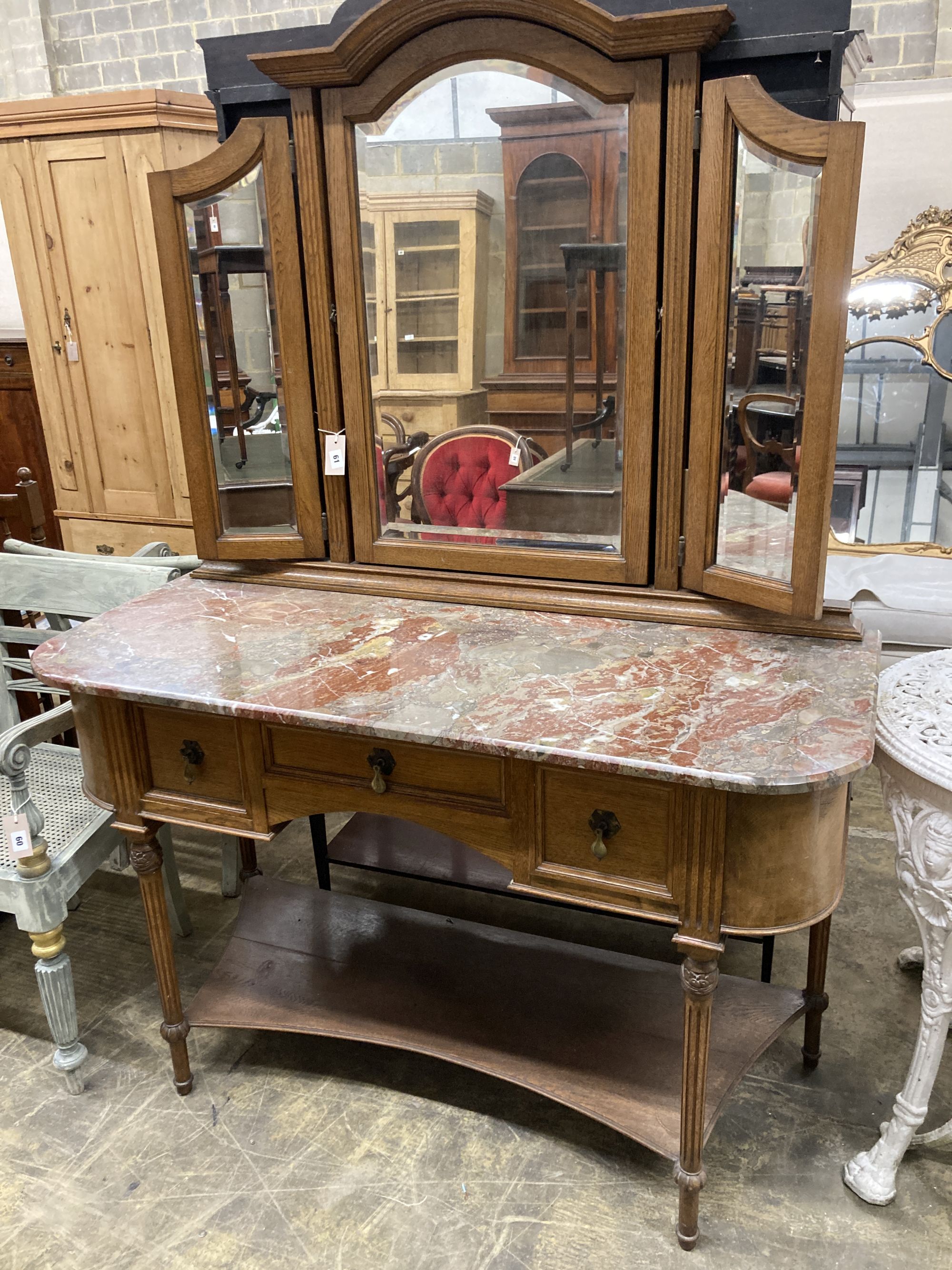 An early 20th century French marble topped mirror back dressing table, length 127cm, depth 55cm, height 182cm